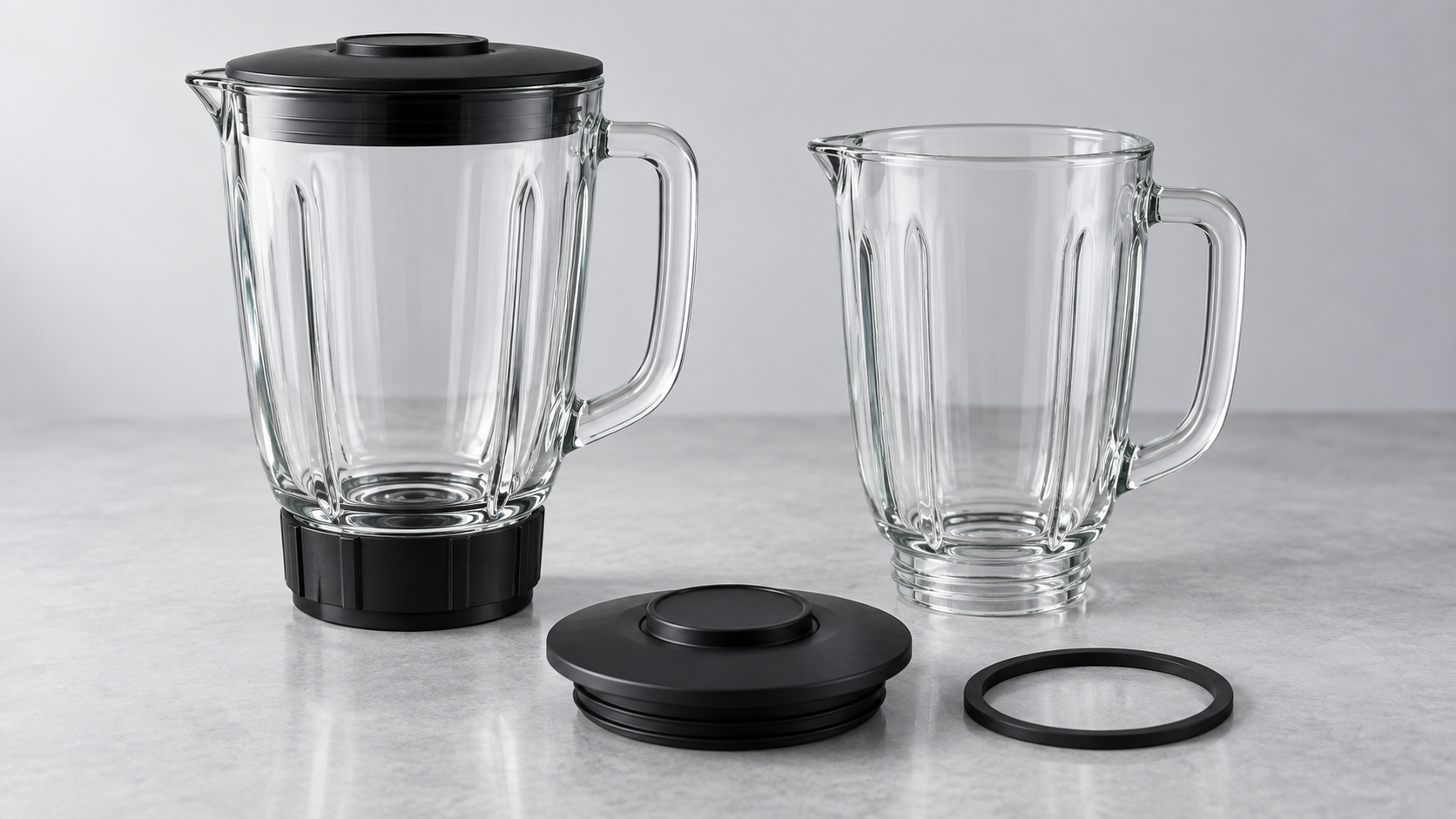 Product illustration of glass blender jars with separate lid and seal